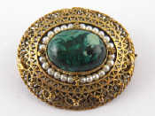 Appraisal: An Israeli gilt metal tests silver oval filigree brooch set