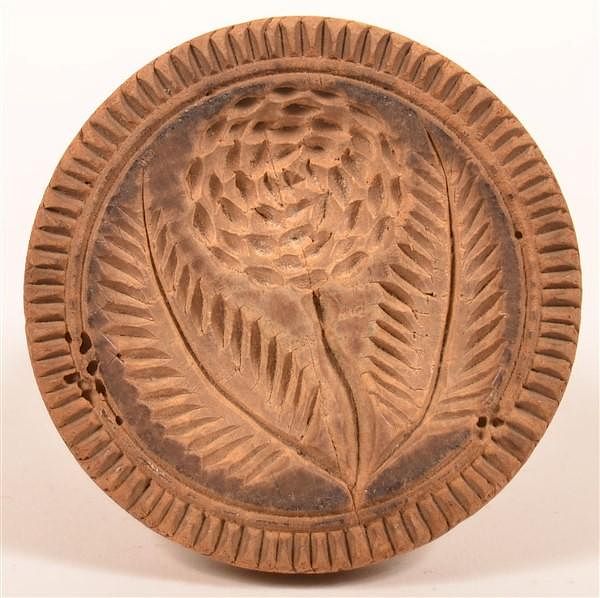 Appraisal: Pennsylvania Floral Carved Butter Print Pennsylvania th Century Single Piece