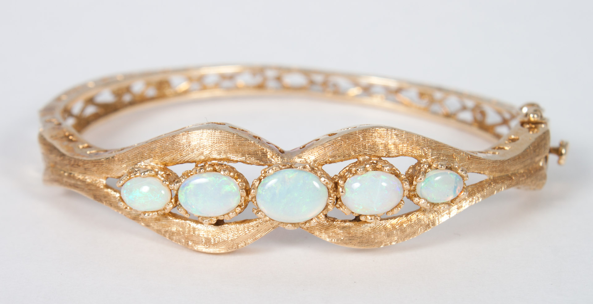 Appraisal: Lady's K gold and opal bangle bracelet gold florentined and