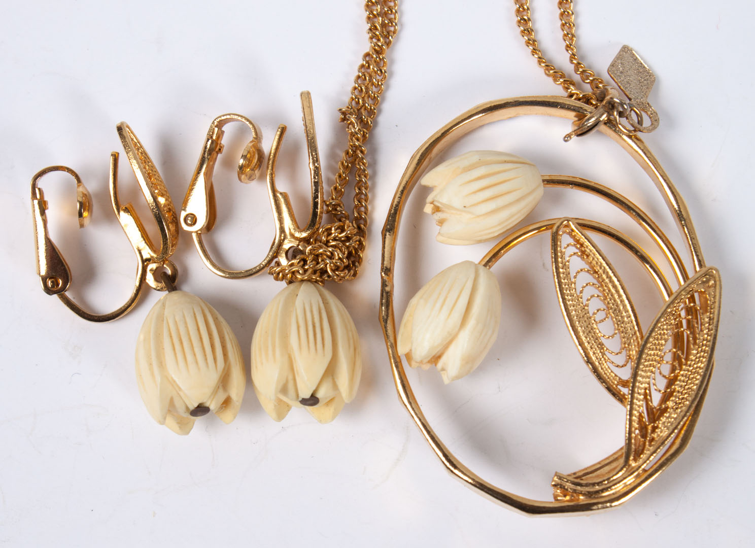 Appraisal: Carved ivory tulip necklace earrings carved ivory and gilt metal