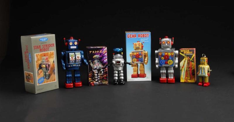 Appraisal: Lot of Tin Contemporary Robot Toys Description Includes four original