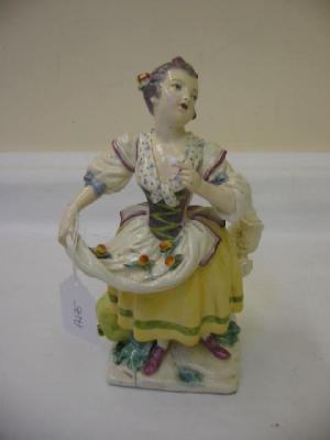 Appraisal: A PORCELAIN FIGURE in the Chelsea style modelled as a