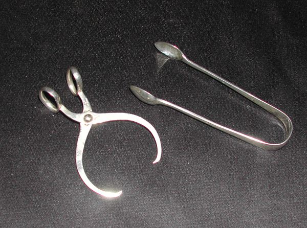 Appraisal: Two Pairs of Sterling Silver Sugar Tongs one Victorian hallmarked