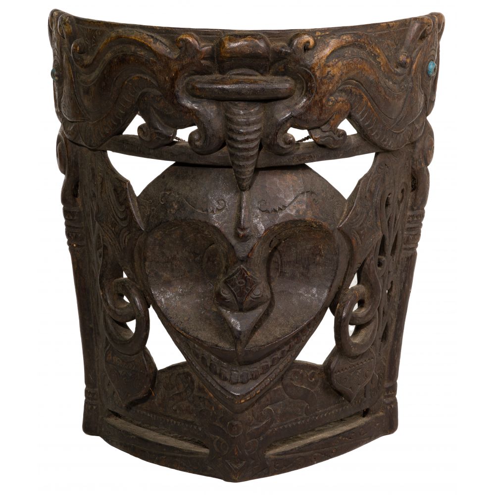 Appraisal: SUMATRAN CARVED WOOD MASKDepicting a central face with ornately carved