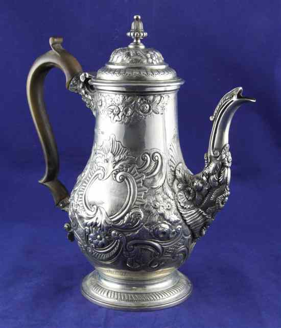 Appraisal: A George IV coffee pot with later embossed floral scroll