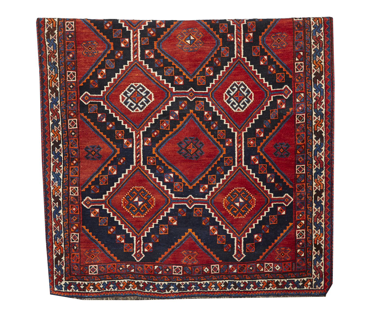 Appraisal: A LARGE TURKISH HAND KNOTTED WOOL RUG Geometric designs on