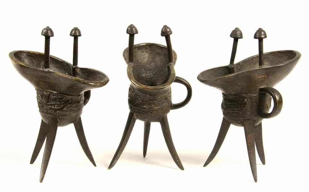 Appraisal: CHINESE BRONZE WINE VESSELS - Three Similar Jue or Ceremonial