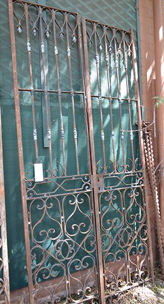 Appraisal: A PAIR OF WROUGHT IRON GATES each with scroll and