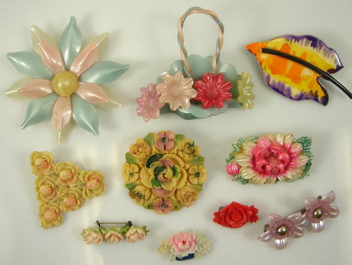 Appraisal: plastic costume jewelry floral pins - long Estimate -