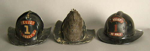 Appraisal: Three Mt Holly Relief fire helmets th c