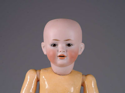 Appraisal: OPEN MOUTH CHARACTER An interesting doll with open mouth fine