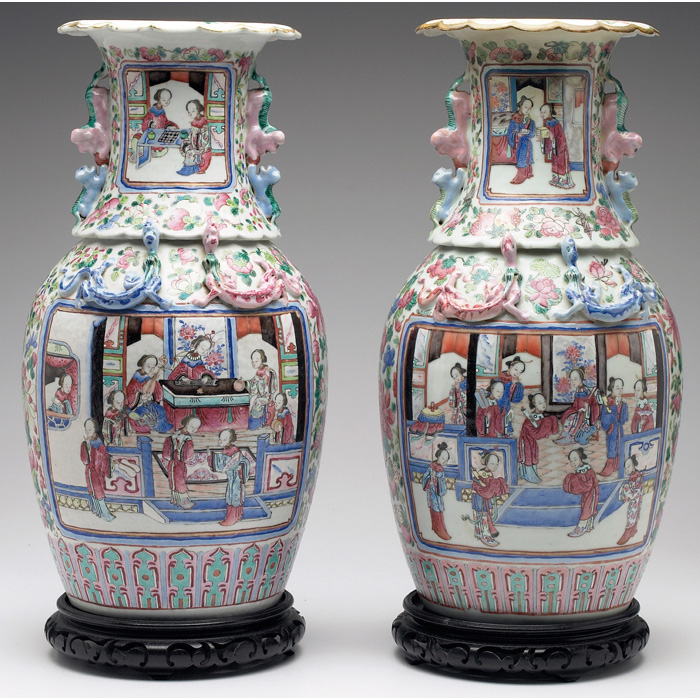 Appraisal: Asian vases pair colorful incised and painted scenes and sculpted