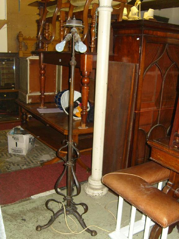 Appraisal: An early electric brass lamp standard with adjustable column with