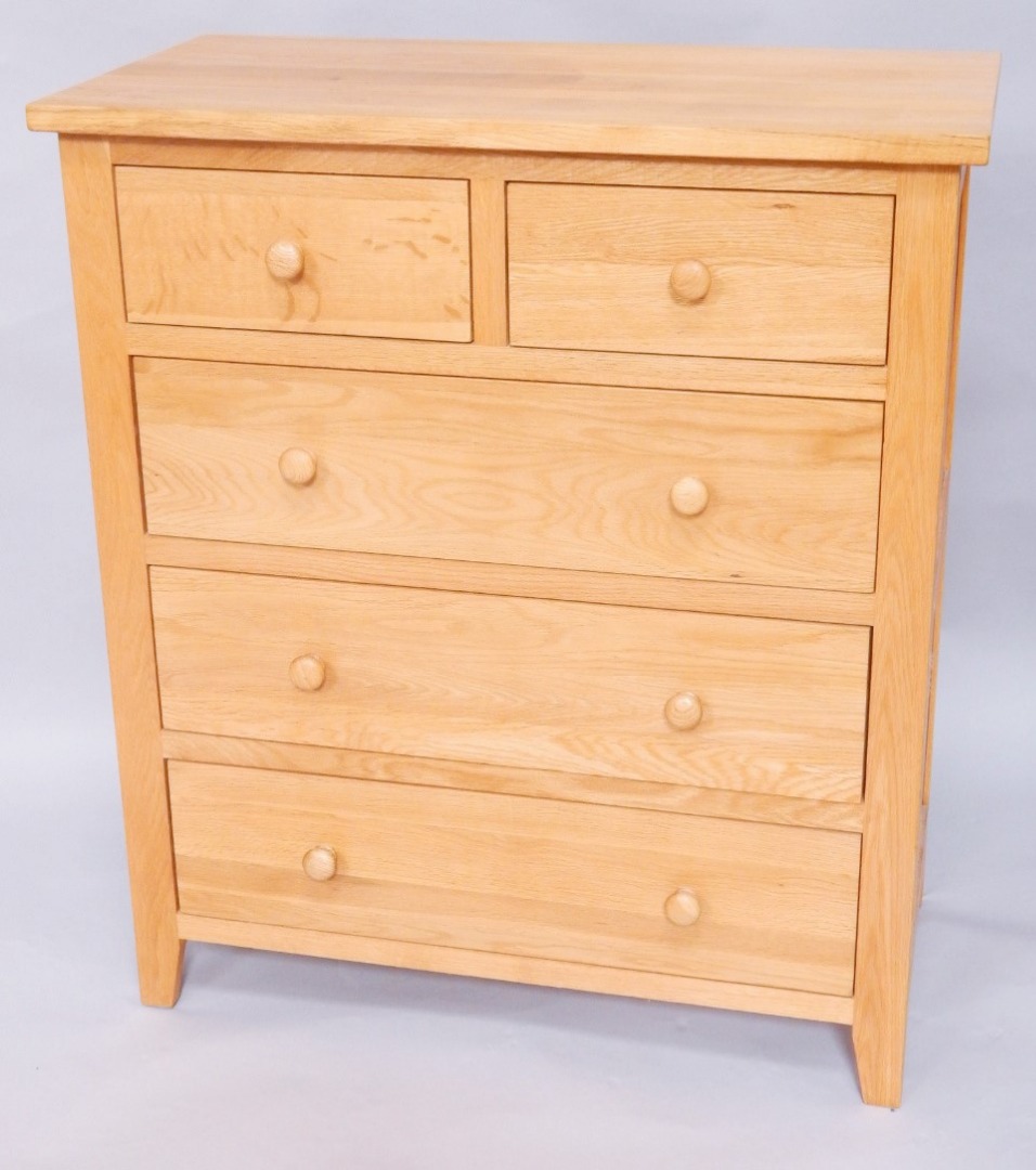 Appraisal: A light oak chest of two short over three long