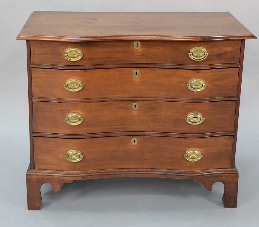 Appraisal: Cherry four drawer chest having molded overhanging top over conforming