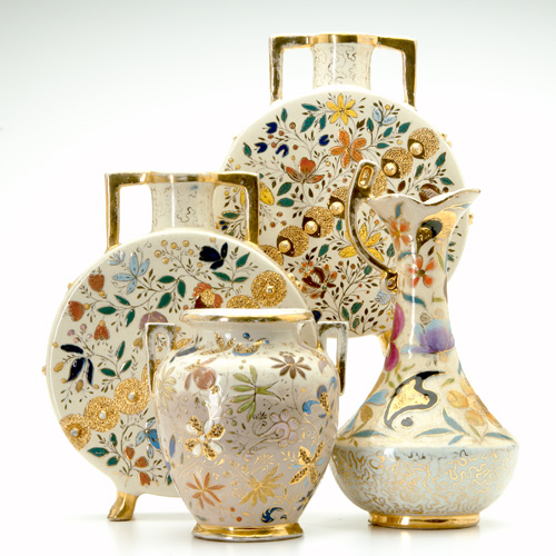 Appraisal: WILLIAM DELL Four Hungarian Faience vases enamel-decorated with floral patterns