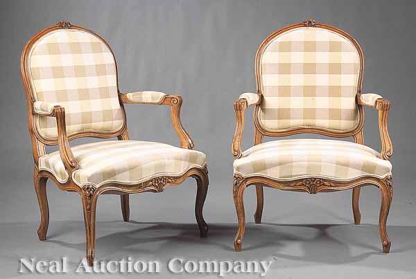 Appraisal: A Pair of Louis XV-Style Carved Beechwood Fauteuils each with