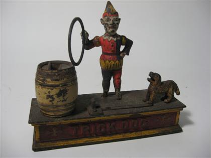 Appraisal: Painted trick dog cast-iron bank late th century Marked under