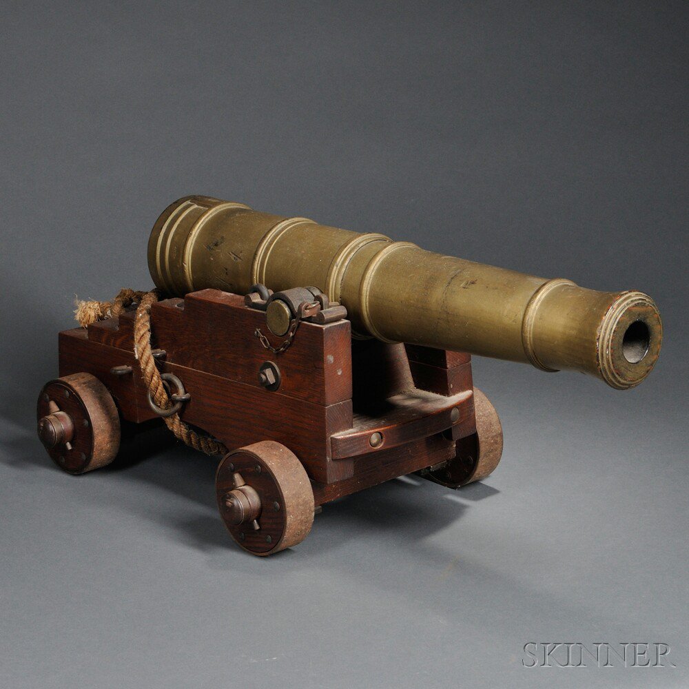 Appraisal: Wooden Ship Cannon Model wooden carriage with steel parts gold-painted