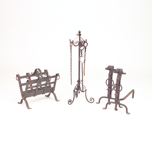 Appraisal: Fireplace accessories including a pair of strap metal andirons and