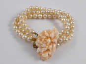 Appraisal: A three row cultured pearl bracelet with a carat gold