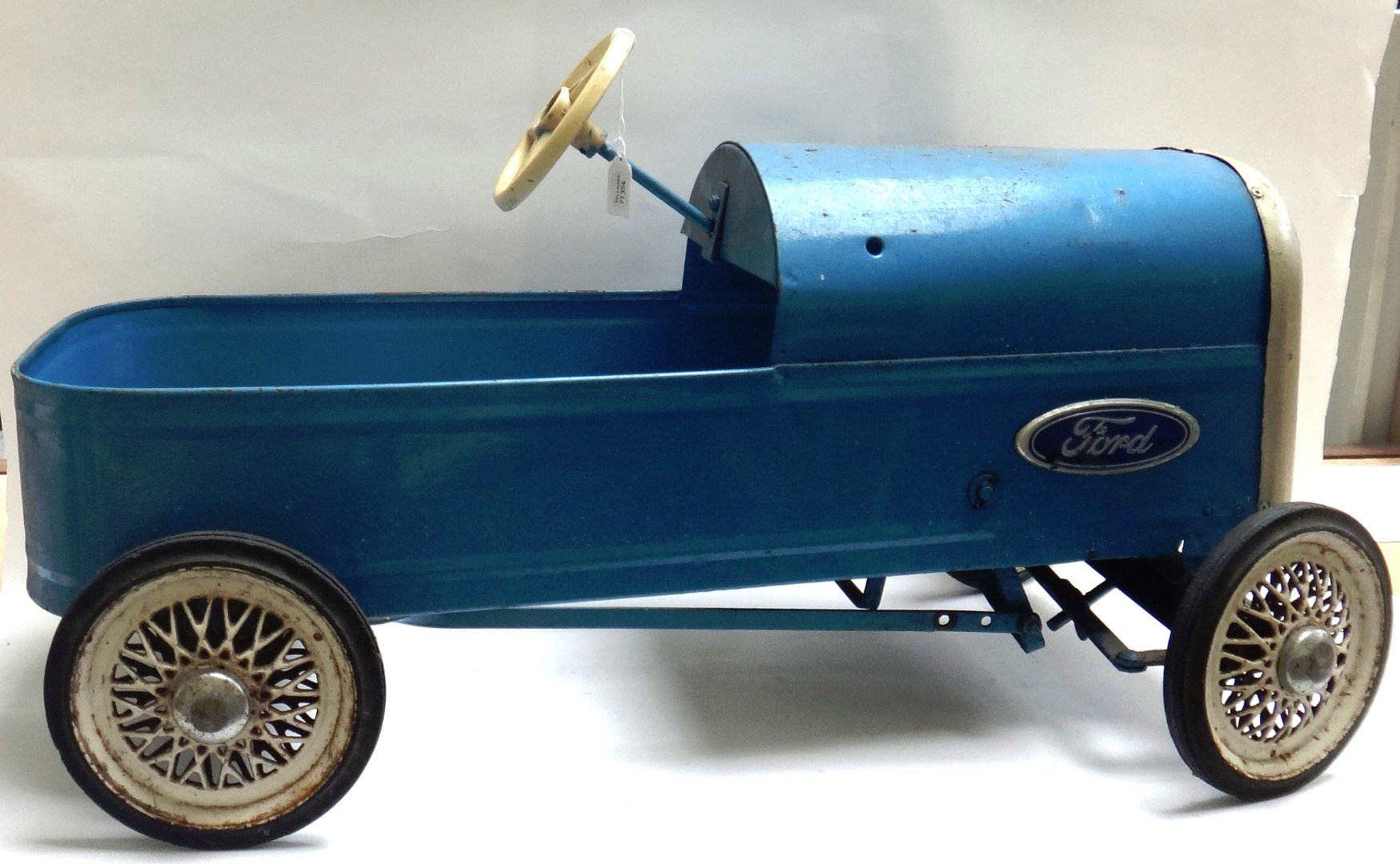 Appraisal: A Triang pressed metal pedal car circa in blue with