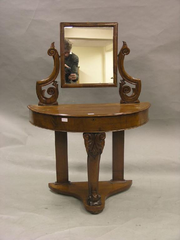 Appraisal: A Victorian mahogany dressing table demi-lune shape with adjustable mirror