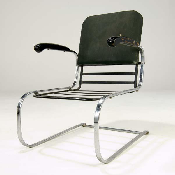 Appraisal: GILBERT ROHDE Armchair with ebonized wood armrests on cantilevered base