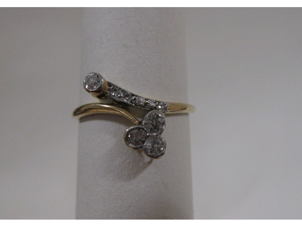 Appraisal: Gold diamond set cross over ring