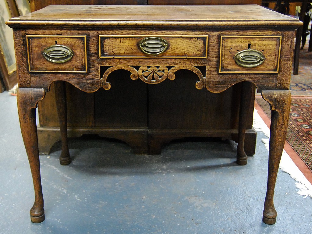 Appraisal: An th century oak lowboy the two plank top over