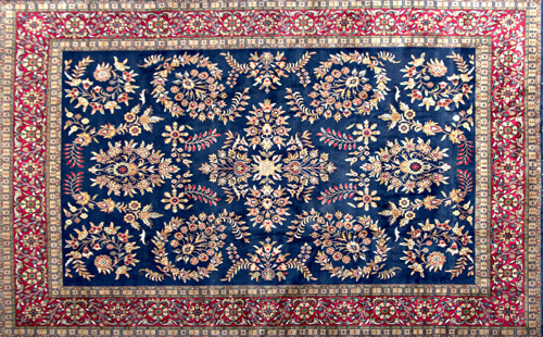 Appraisal: PERSIAN Carpet with overall floral design in straw and scarlet