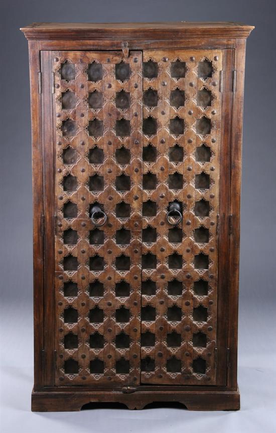 Appraisal: ARCHITECTURAL MOROCCAN TWO-DOOR ENTERTAINMENT CABINET th century and earlier Primitive