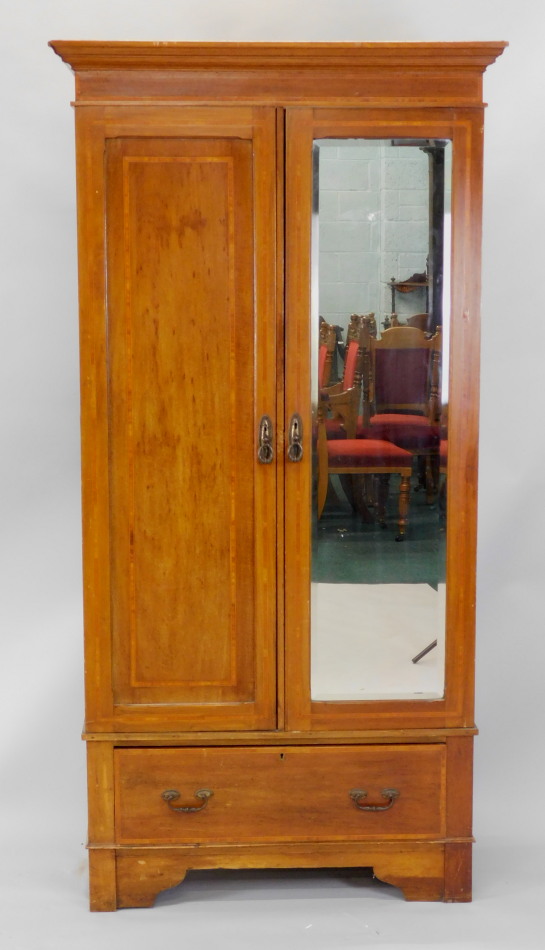 Appraisal: An Edwardian mahogany and satin wood cross banded wardrobe with