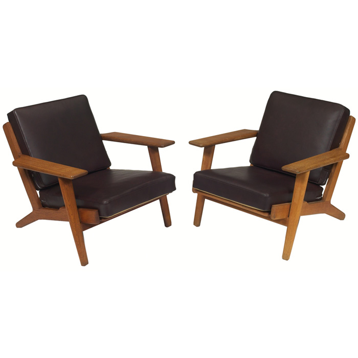 Appraisal: Hans Wegner lounge chairs pair by Getama Denmark oak frames