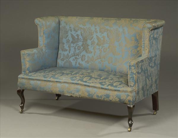 Appraisal: An Edwardian wingback two-seat sofa early th century upholstered in