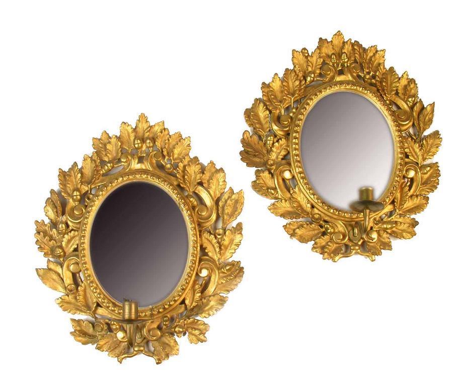 Appraisal: A pair of th century continental giltwood and gesso girandoles