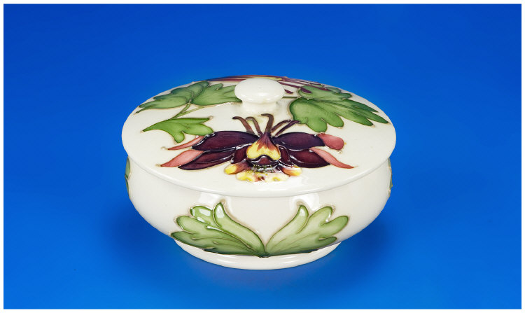 Appraisal: Moorcroft Powder Bowl Cover Columbine Pattern on Green Ground Marks