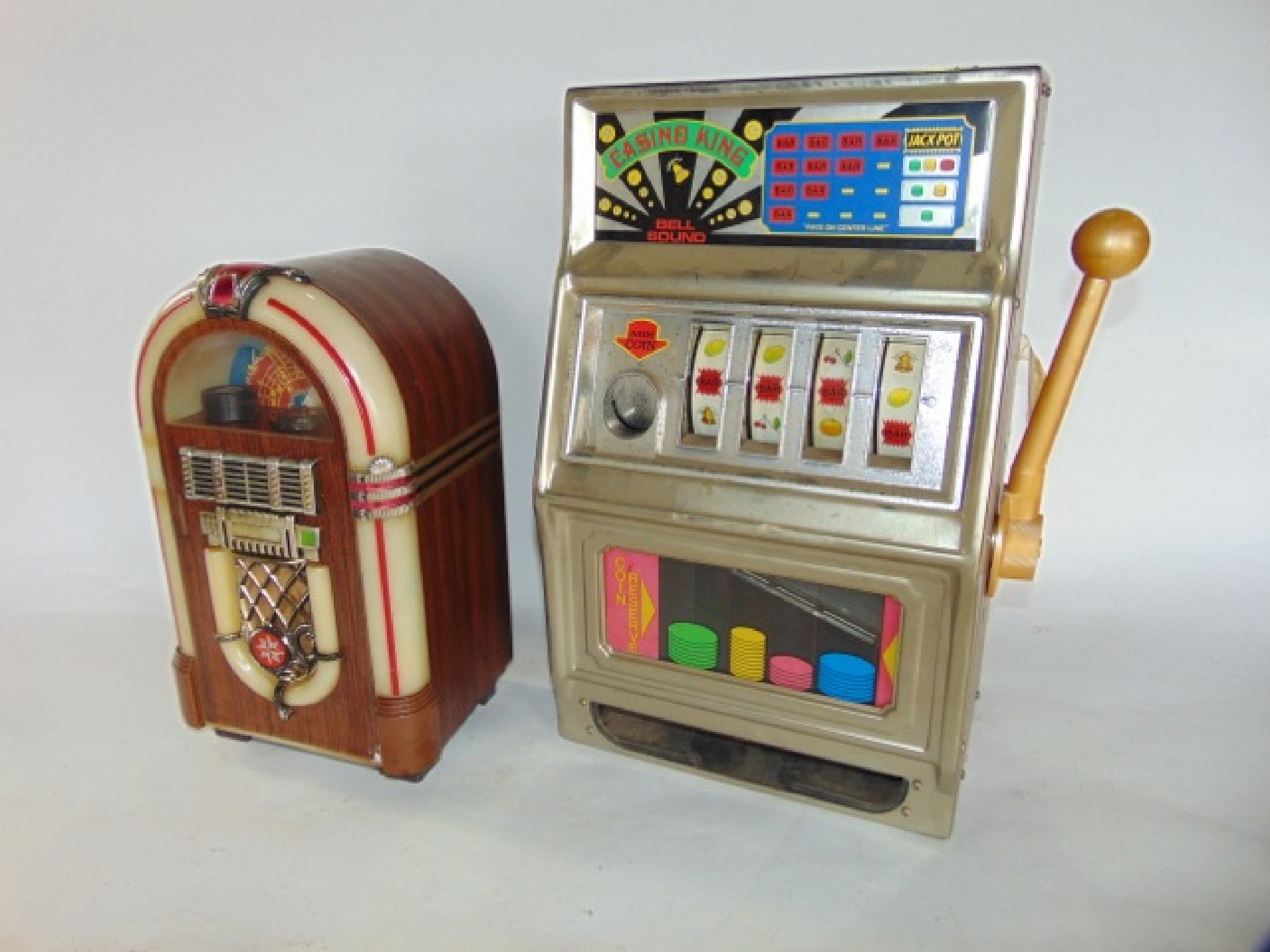 Appraisal: A miniature one arm bandit type slot fruit machine unit