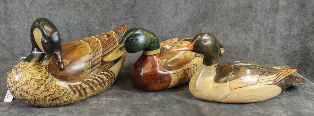 Appraisal: THREE HAND CARVED DECORATIVE DECOYS mallard duck signed on base