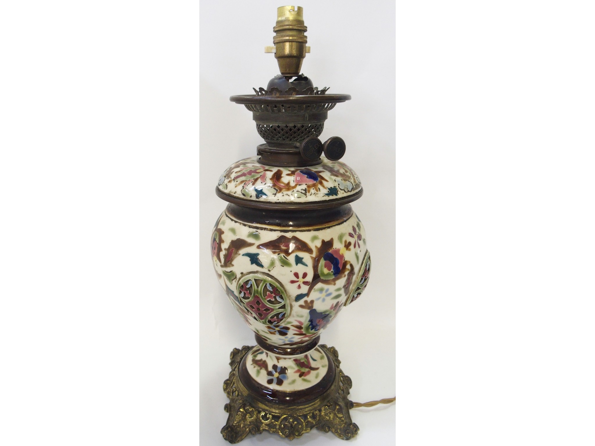 Appraisal: Enamelled porcelain and patinated metal mounted oil lamp