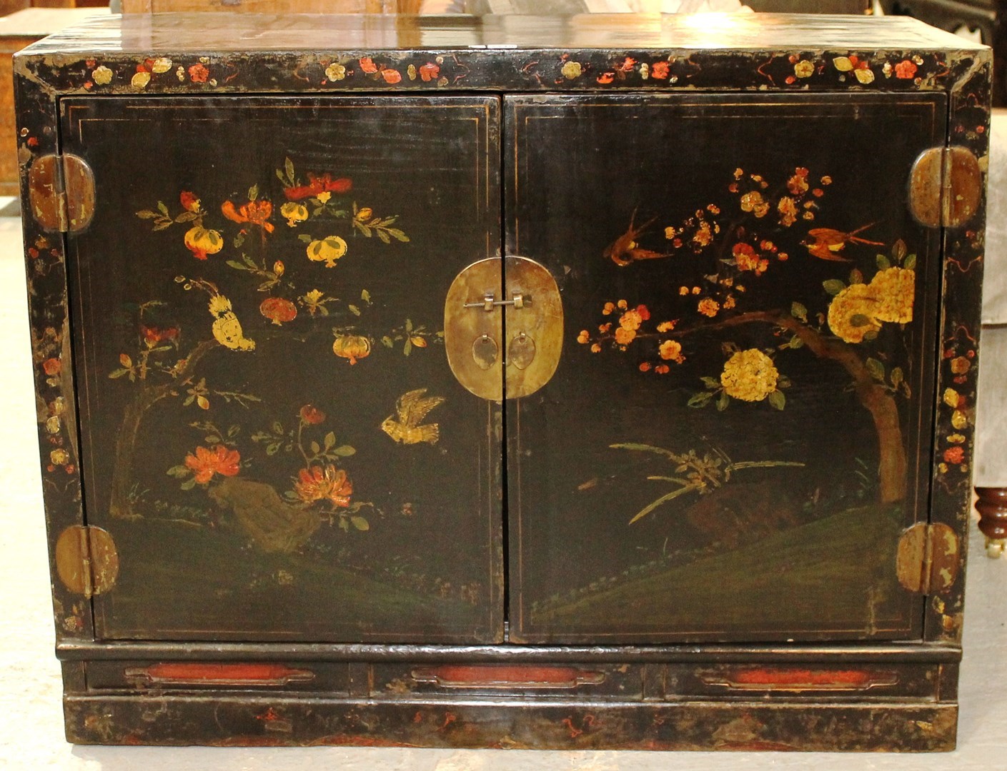 Appraisal: A pair of th century Chinese black lacquer floral painted