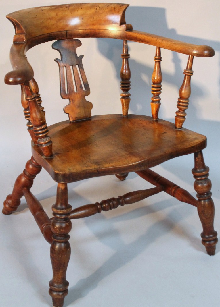 Appraisal: A thC ash and elm smoker's bow chair with a