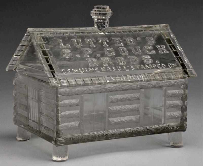 Appraisal: Glass -Piece Lutted's Cough Drops Log Cabin Jar Description Lutted's