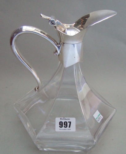 Appraisal: A plated metal mounted glass decanter of waisted hexagonal design