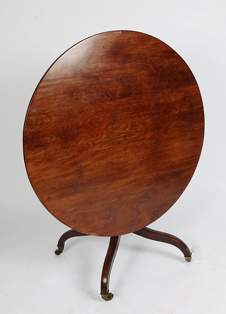 Appraisal: A REGENCY MAHOGANY TILT TOP PEDESTAL BREAKFAST TABLE with quadruple