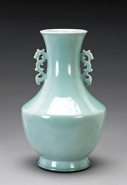 Appraisal: A celadon glazed porcelain vase with reticulated dragon handles Late