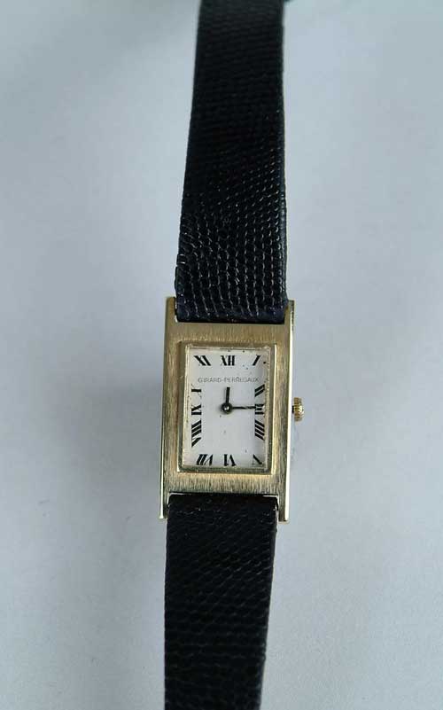 Appraisal: K YELLOW GOLD WRISTWATCH BY GIRARD-PERREGAUX Rectangular dial marked Girard-Perregaux