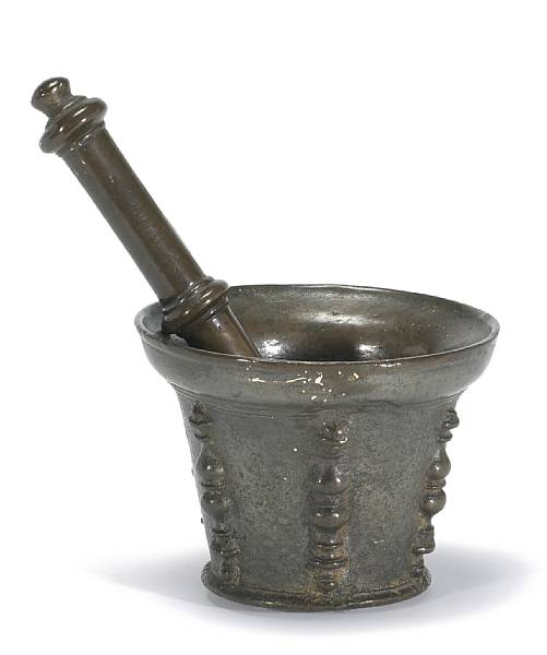 Appraisal: A Continental bronze mortar and pestle th century Decorated with