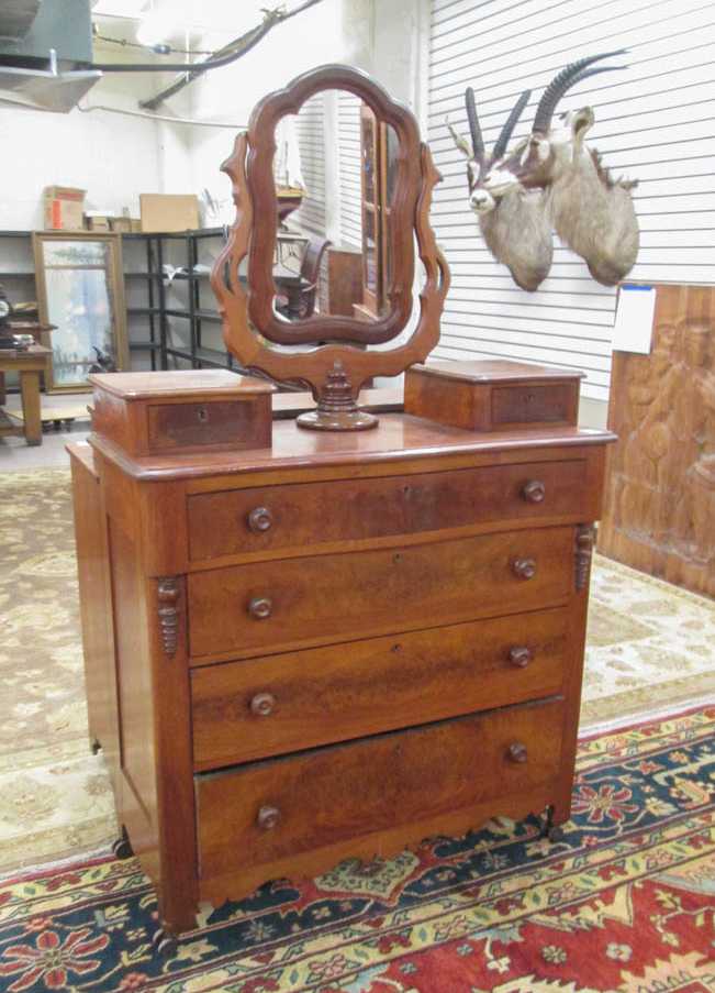 Appraisal: A VICTORIAN WALNUT DRESSER WITH SWIVEL MIRROR American c a