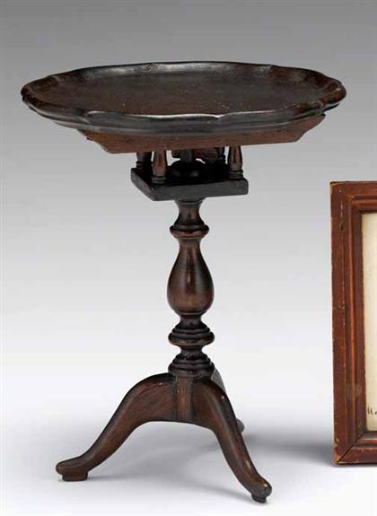 Appraisal: Miniature Chippendale mahogany tilt-top table The pie crust top tilts